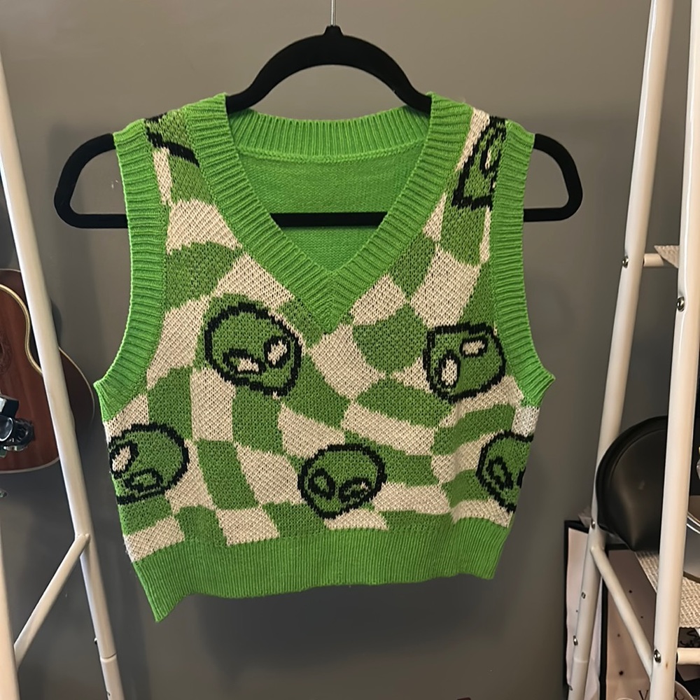 green alien sweater vest